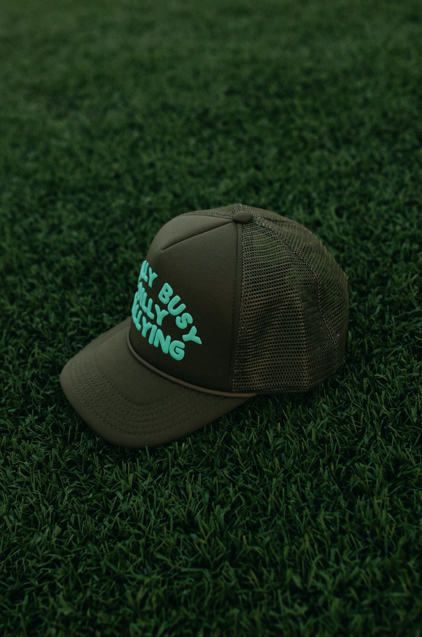 Really Busy Dilly Dallying Trucker Hat in Olive/Mint
