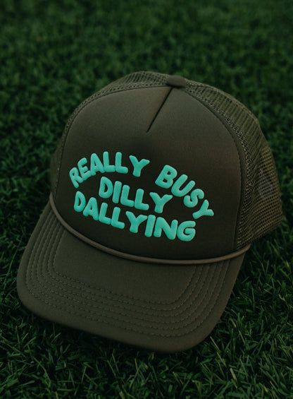 Really Busy Dilly Dallying Trucker Hat in Olive/Mint
