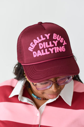 Really Busy Dilly Dallying Trucker Hat in Burgundy/Pink