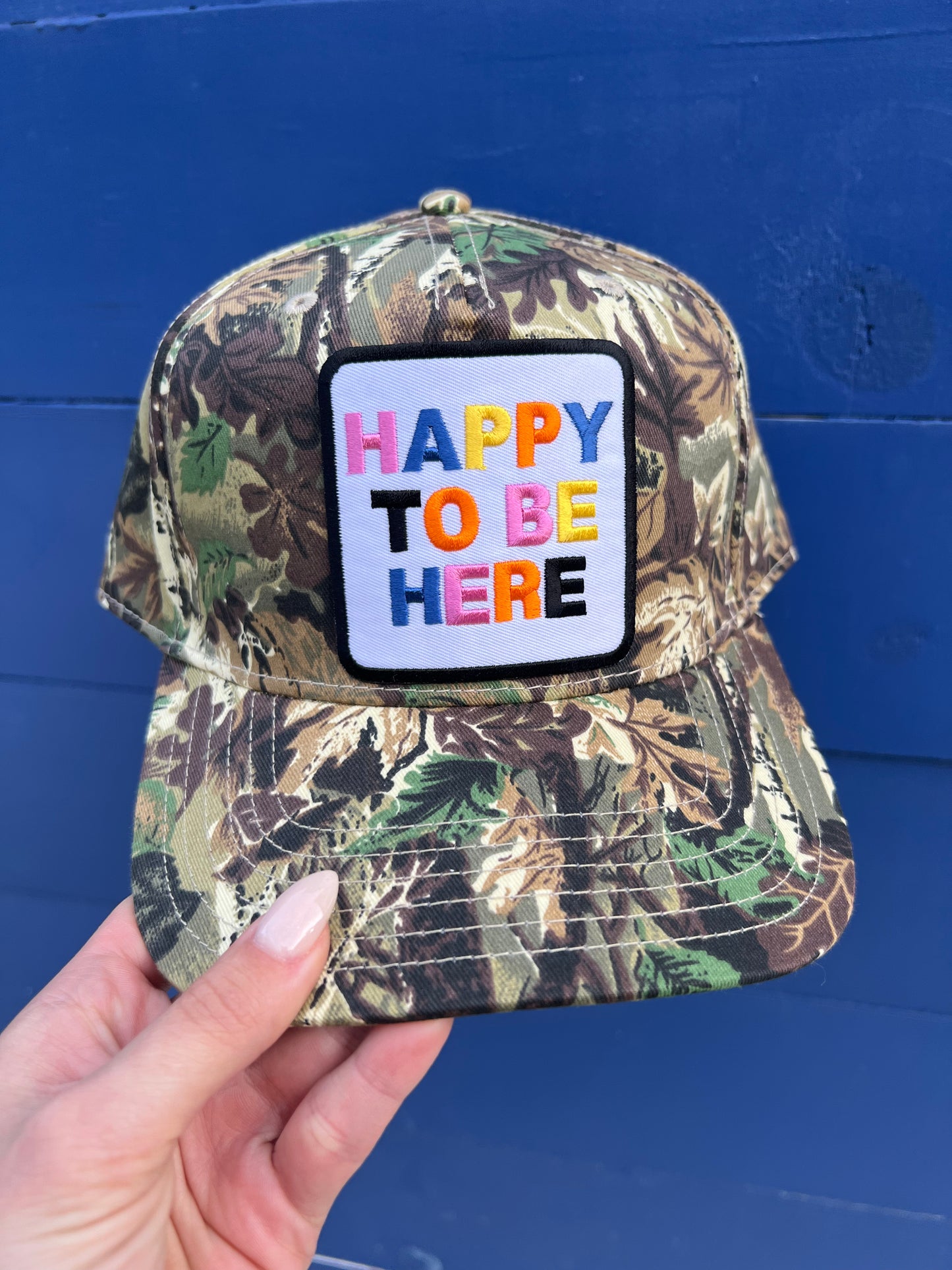 Happy to Be Here Camo Trucker