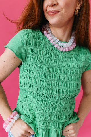 Teagan Smocked Ruffle Hem Top in Green