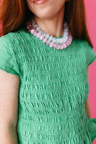 Teagan Smocked Ruffle Hem Top in Green